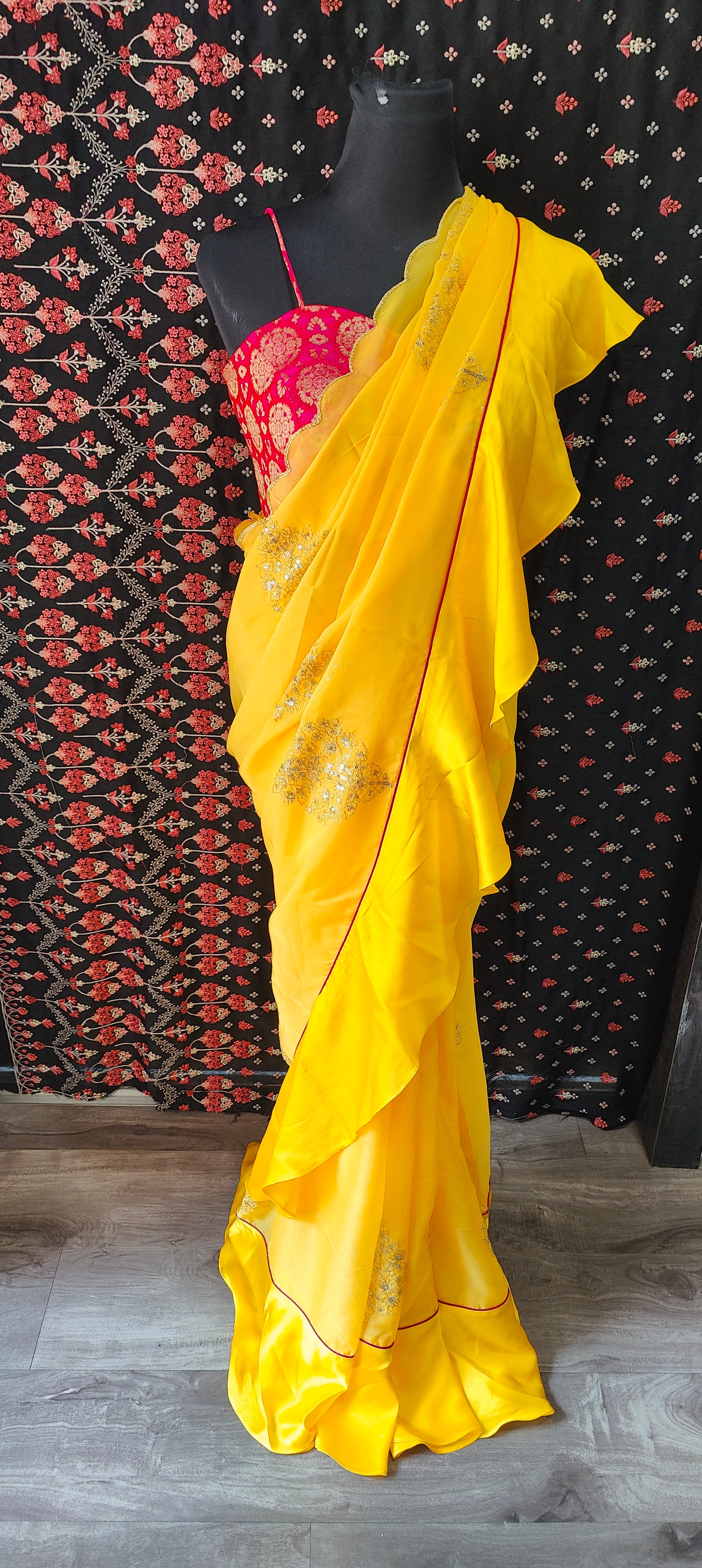 Yellow Organza Ruffle Saree with Pink Brocade Blouse