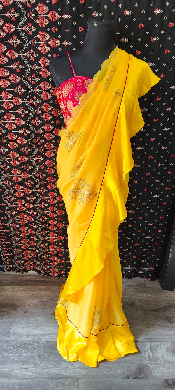Yellow Organza Ruffle Saree with Pink Brocade Blouse
