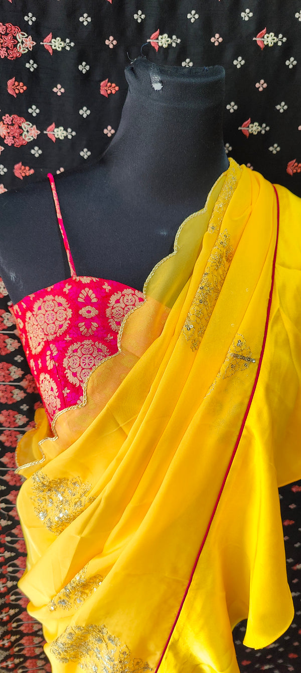 Yellow Organza Ruffle Saree with Pink Brocade Blouse