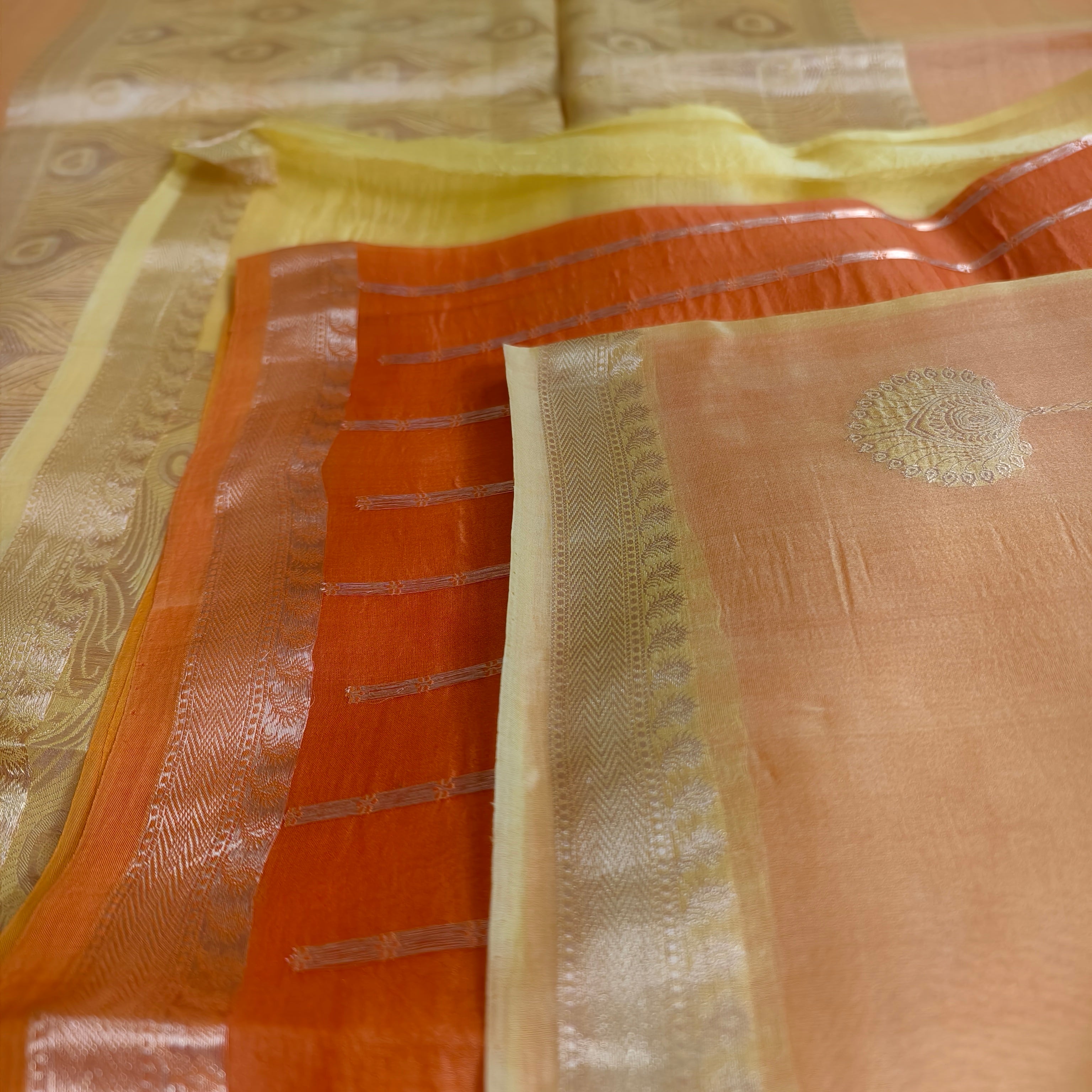 Half and half pale orange and dark orange silk organza saree