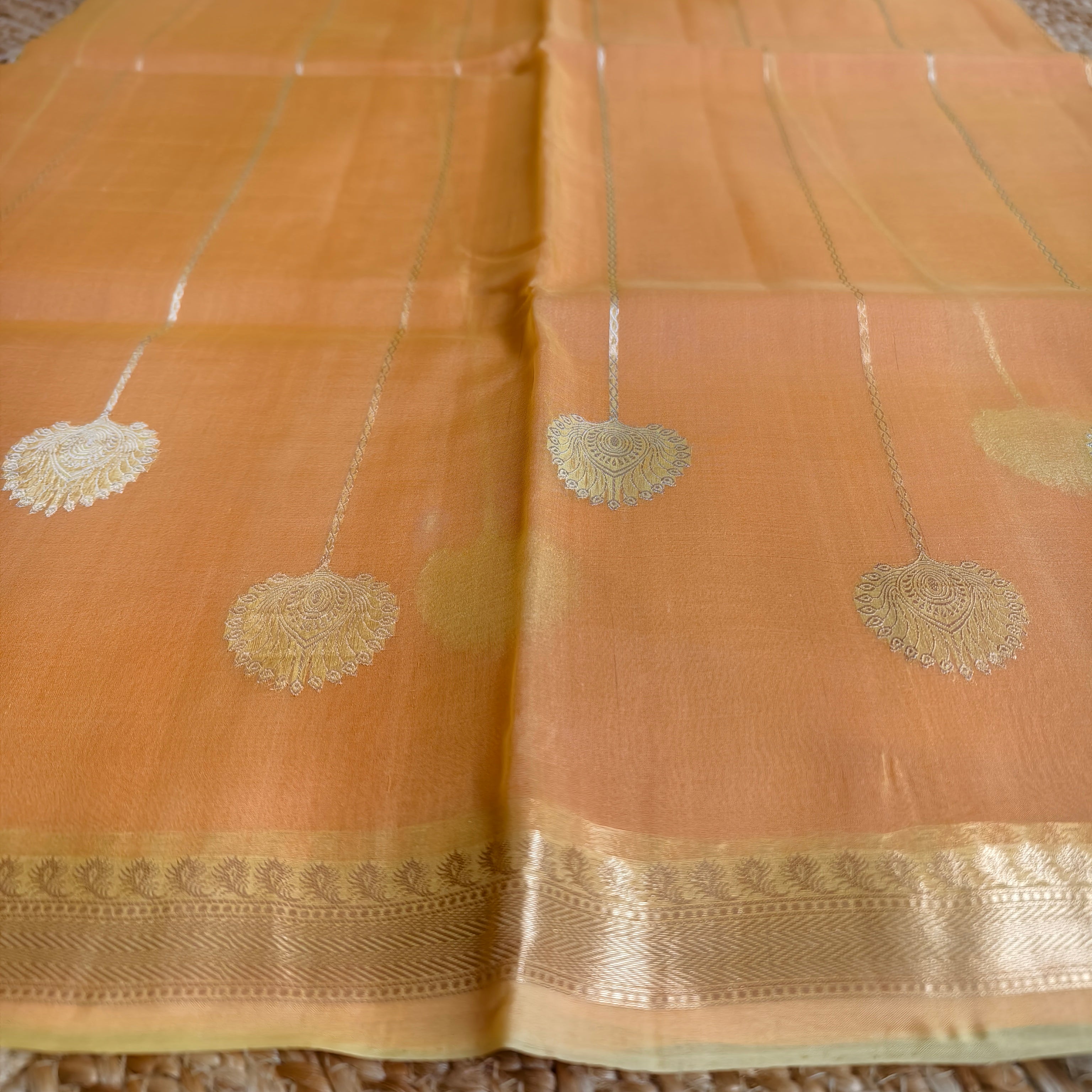 Half and half pale orange and dark orange silk organza saree