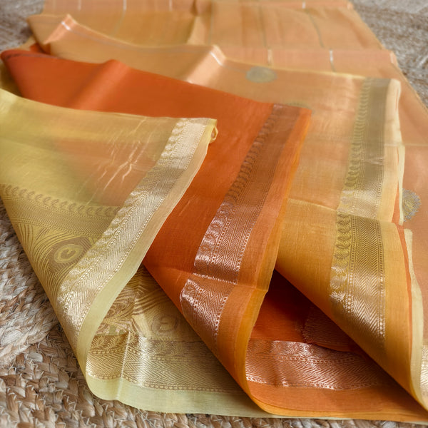 Half and half pale orange and dark orange silk organza saree