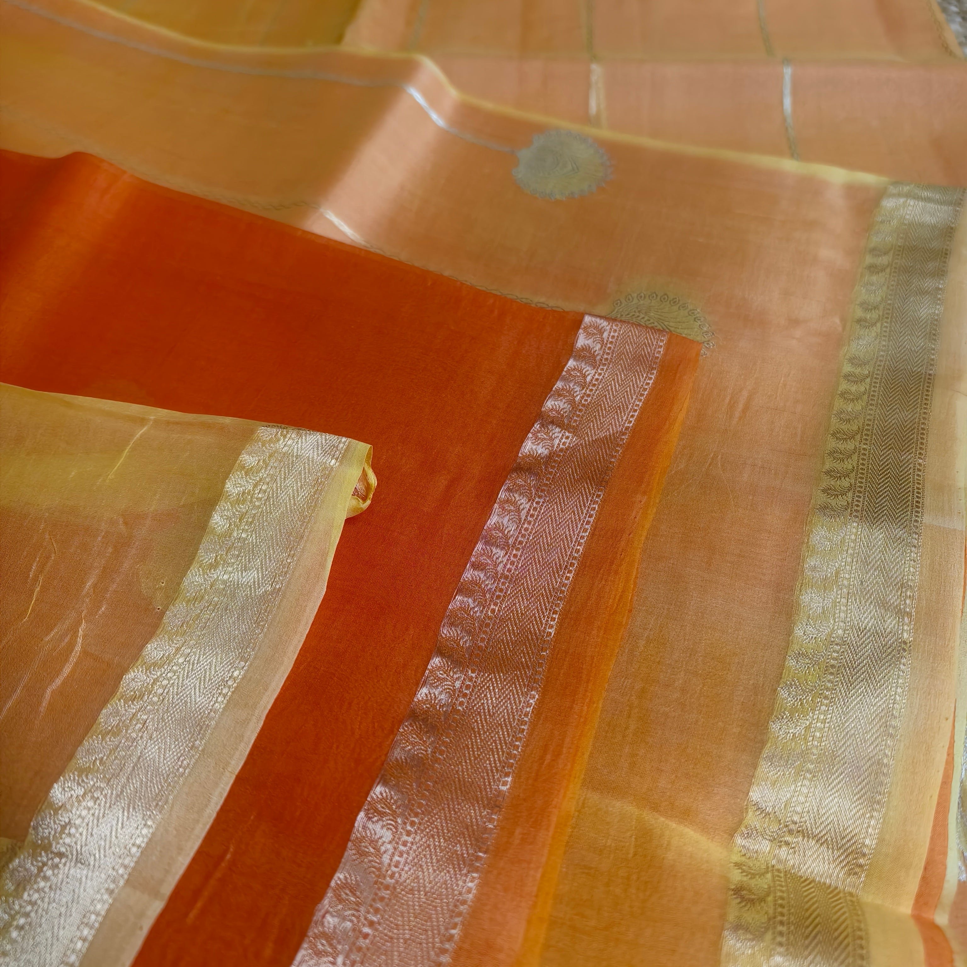 Half and half pale orange and dark orange silk organza saree
