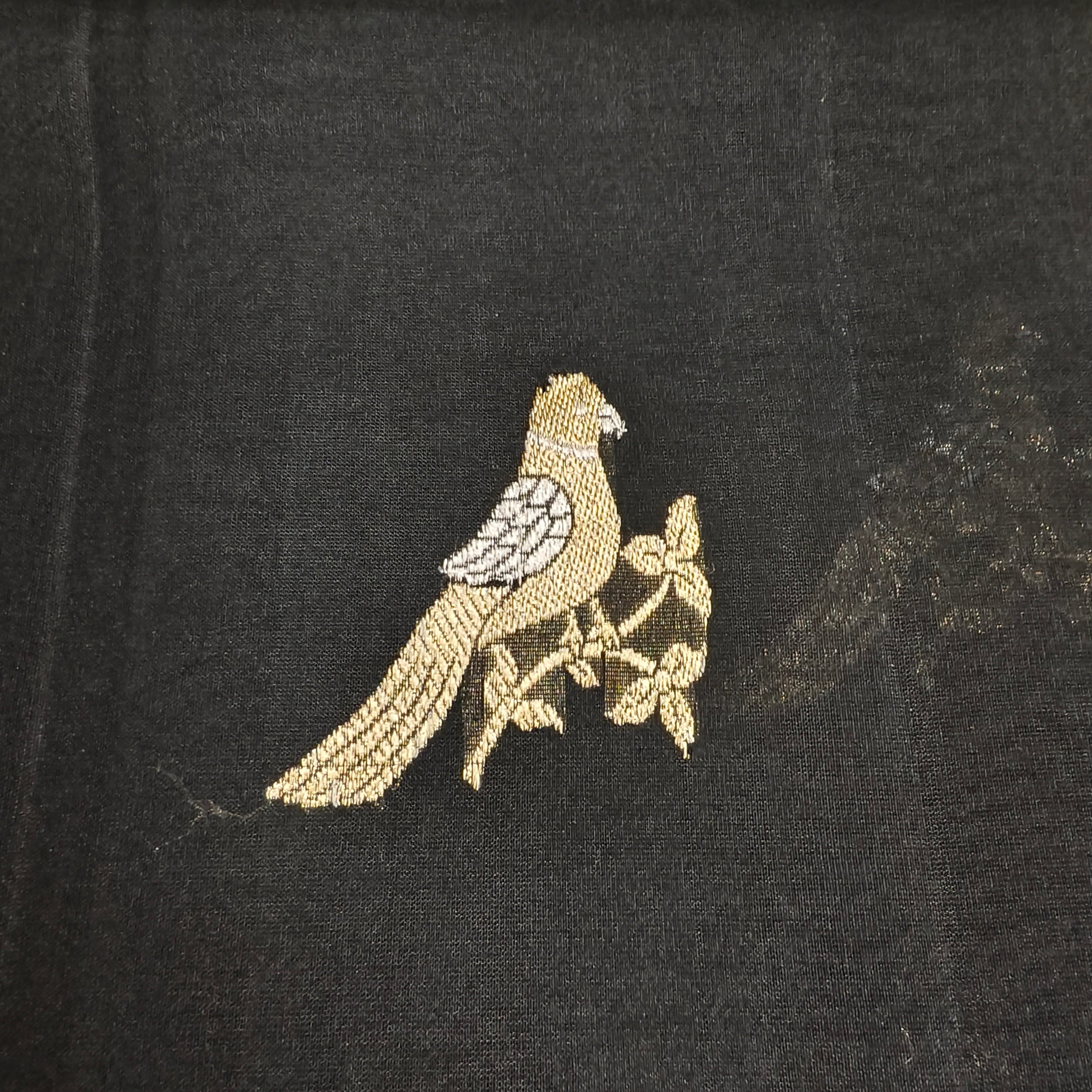 Black silk organza saree with small bird shaped weaving