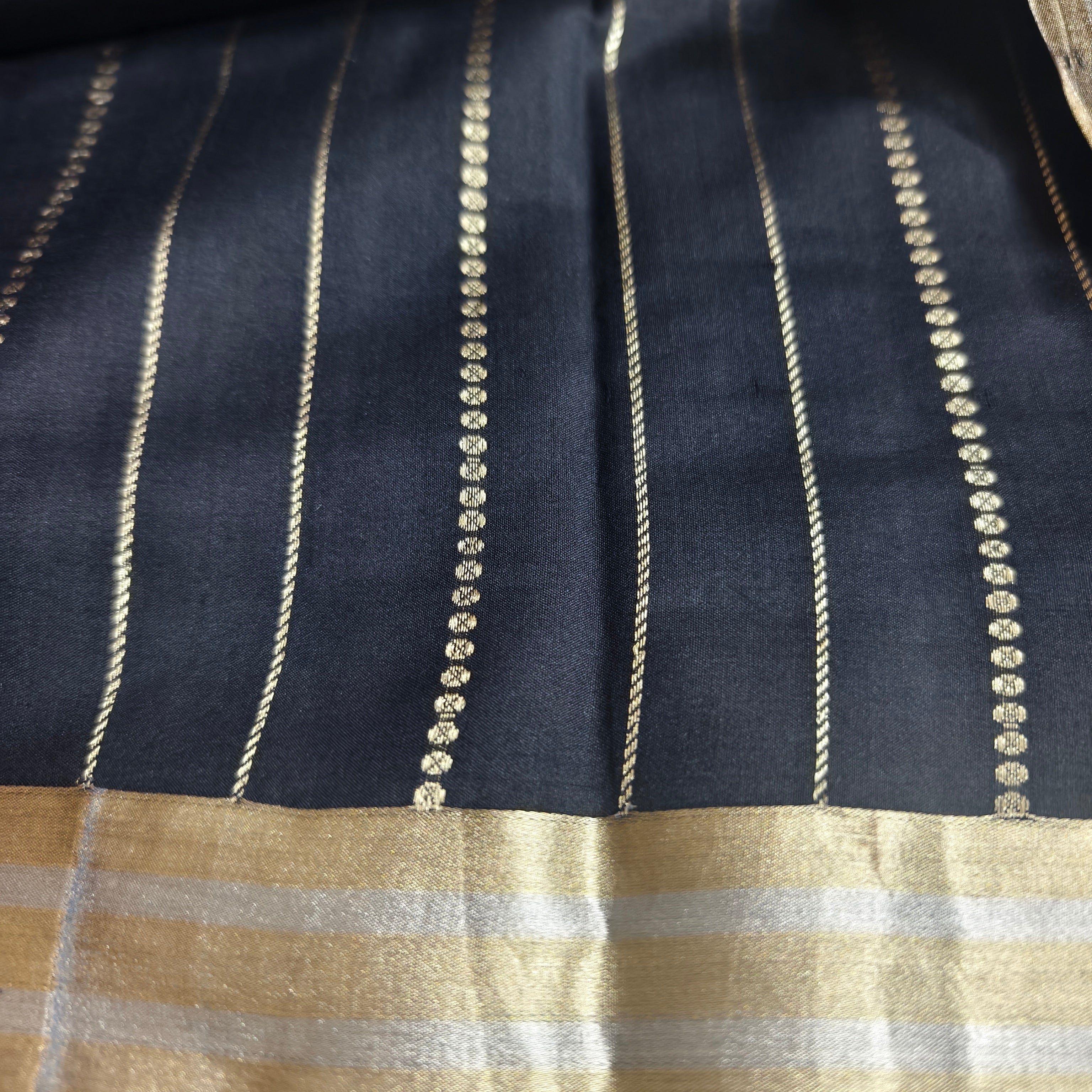 Black silk organza saree with small bird shaped weaving