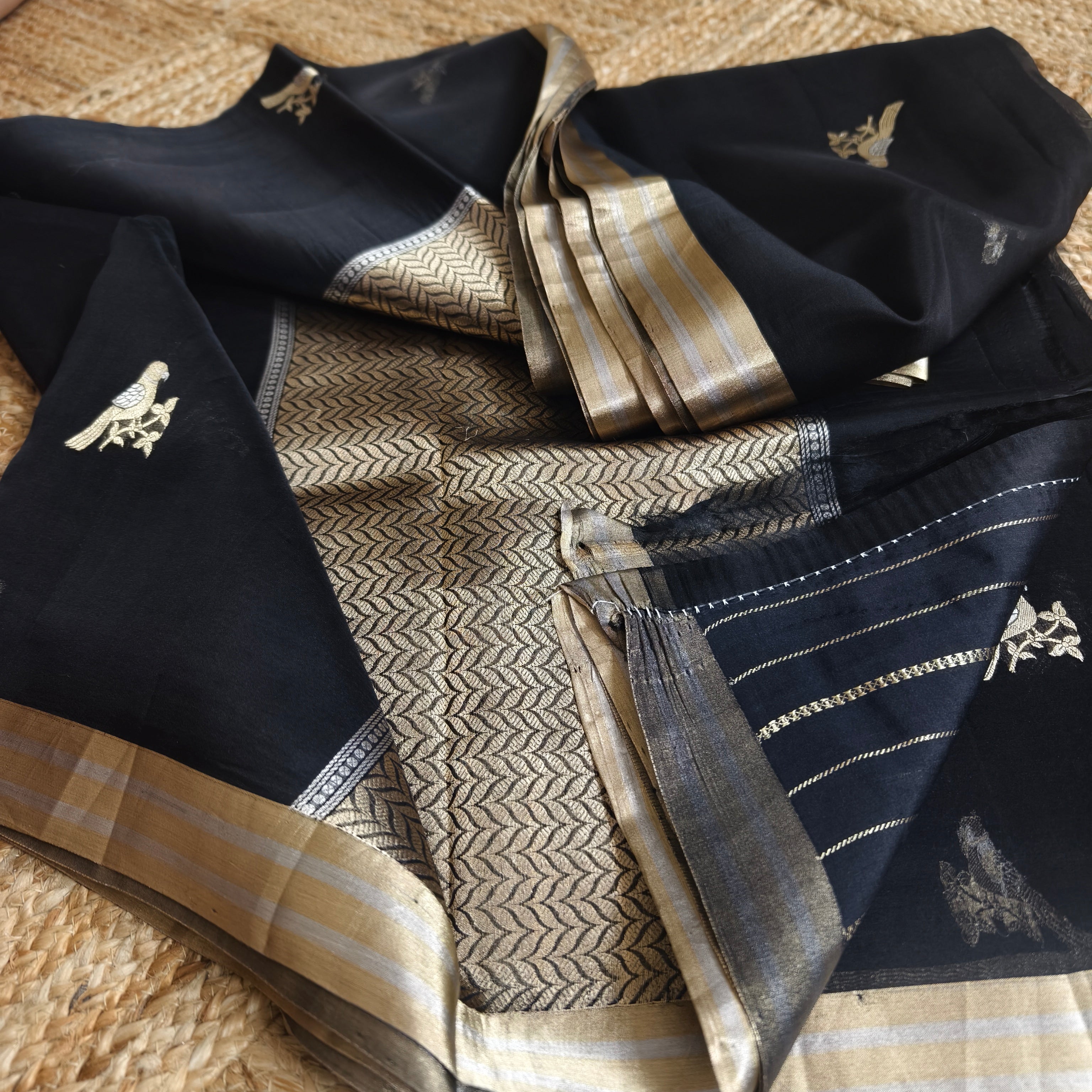 Black silk organza saree with small bird shaped weaving