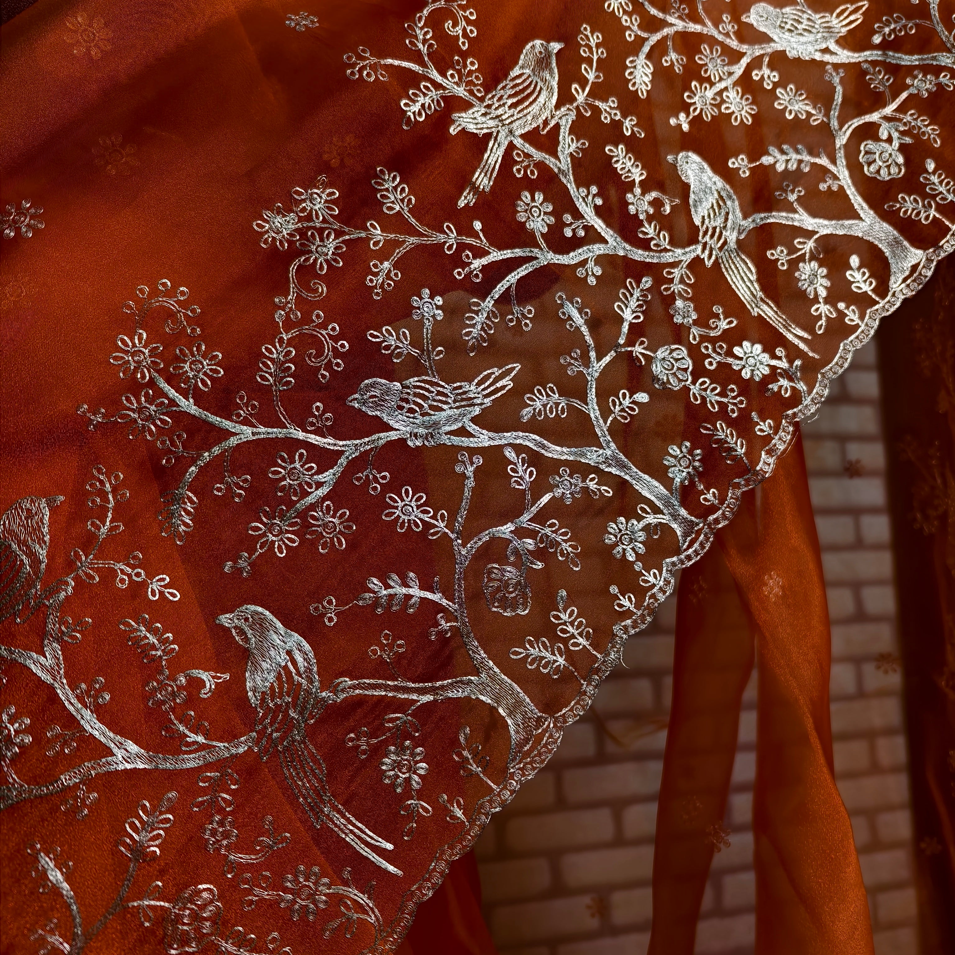 Vibrant orange tissue organza saree